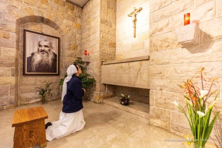 The young Lebanese nun Nataly praying at the tomb of Blessed Capuchin Jacques of Ghazir (1875-1954) founder in 1920 of the congregation of the Franciscan Sisters of the Cross of Lebanon, dedicated to caring for mental patients and the elderly in Beirut (Lebanon). The Capuchin priest Jacques of Ghazir was beatified in 2008 and is buried in this church in the north of Beirut, in the Jal al-Dib neighbourhood, in the same complex where the Psychiatric Hospital of the Cross, which houses 800 patients, is also located.