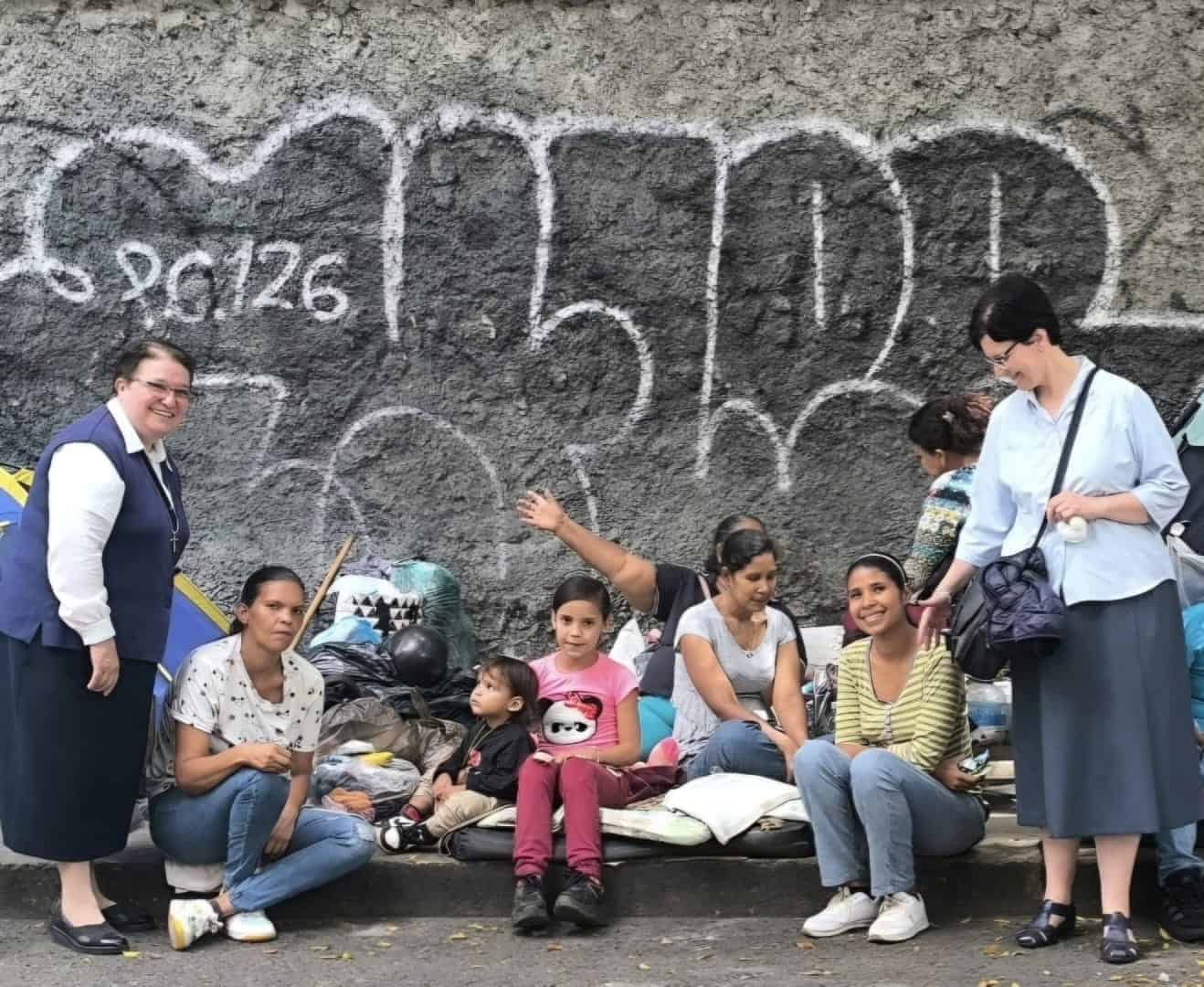 Sister Disciples of the Divine Master during handing out medals of the Divina Pastora-the Marian devotion whose shrine is located in Barquisimeto-to rescuers and earthquake victims.